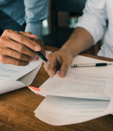 Two people reviewing a report.